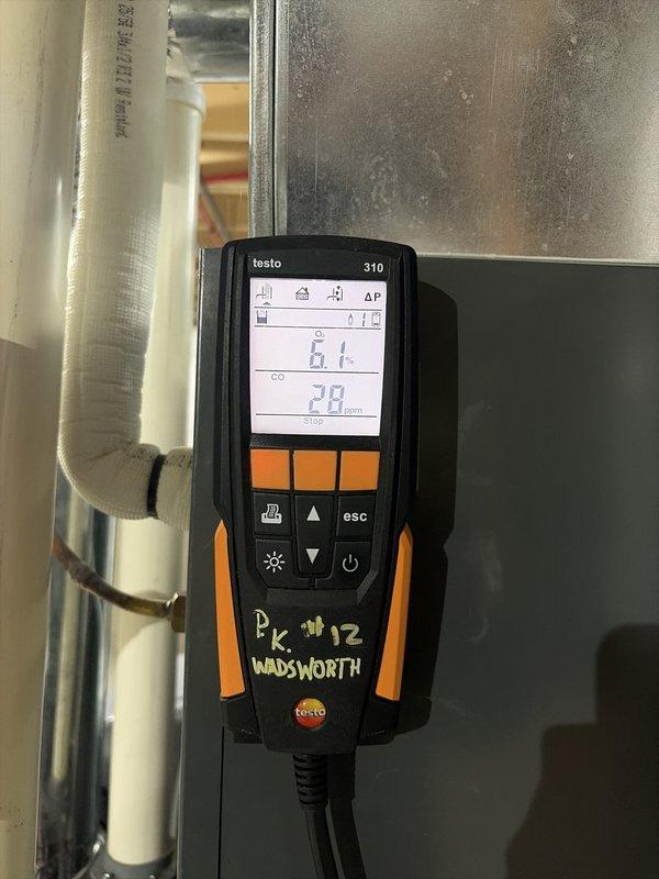 Performed comprehensive heating system maintenance on HVAC unit. Conducted thorough inspection of internal components including circuit board, electrical connections, wire harnesses, and blower assembly with access panel removed. Performed combustion analysis testing using calibrated analyzer, recording readings of 61°F and 28 ppm to verify proper system operation and combustion efficiency. All components found operating within normal parameters and unit returned to service.