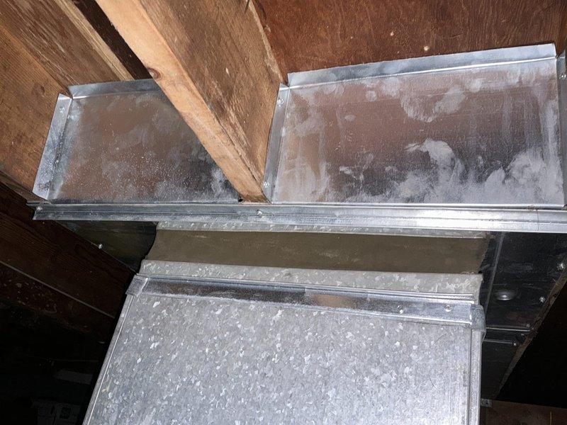 Performed site evaluation for oil to gas furnace conversion. Assessed existing heating system configuration, including current ductwork conditions in attic space. Documented existing rectangular galvanized metal duct system showing significant dust accumulation and age-related weathering. Evaluated structural access points and available space for new gas furnace installation. Provided customer with conversion options and equipment recommendations for transitioning from oil-fired to gas-fired heating system.