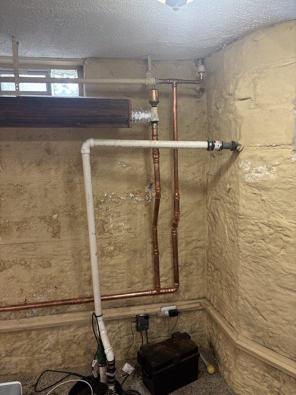 Completed boiler installation in basement utility area, integrating new heating system with existing copper and PVC plumbing infrastructure. Installation included proper venting, connection to water supply lines, and verification of all mechanical and electrical connections for safe operation. System tested and confirmed operational with all safety controls functioning properly. Completed boiler installation in basement utility area, integrating new heating system with existing copper and PVC plumbing infrastructure. Installation included proper venting, connection to water supply lines, and verification of all mechanical and electrical connections for safe operation. System tested and confirmed operational with all safety controls functioning properly.