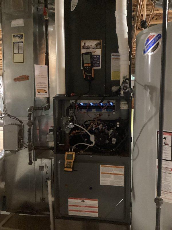 # HVAC Heating Maintenance Service

Performed comprehensive heating system maintenance on residential furnace as part of ongoing preventative maintenance program. Conducted thorough inspection of furnace unit with access panel removed, examining internal components including flame sensors, ignition system, copper refrigerant lines, gas connections, and electrical wiring. Completed requested blower wheel cleaning to remove accumulated dust and debris that can reduce system efficiency and airflow. Utilized diagnostic multimeter to verify proper electrical readings and system performance parameters. Inspected associated HVAC equipment including air handler unit and verified all safety labels and specifications were intact. All components found to be operating within manufacturer specifications following maintenance procedures.
