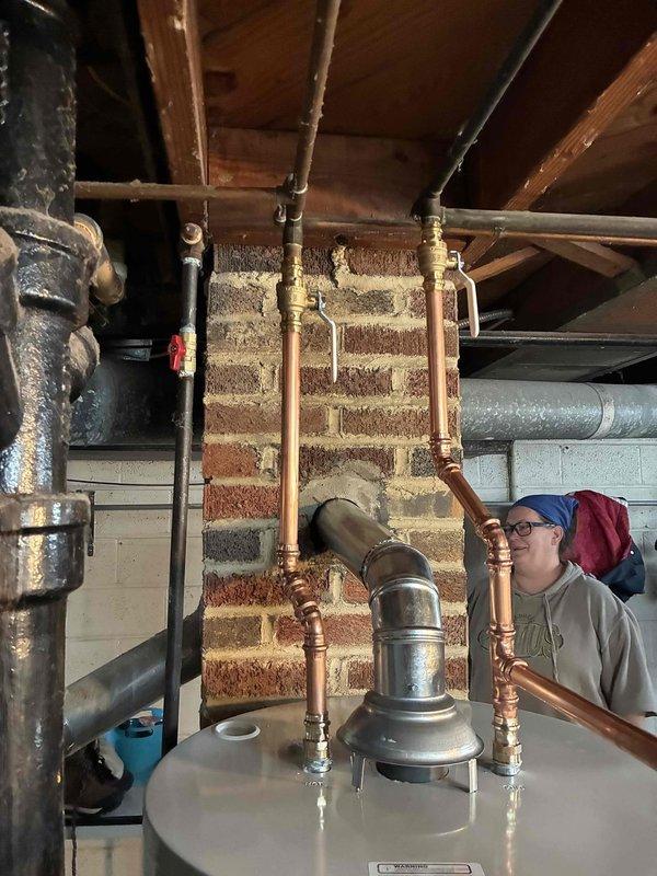 Replaced a 50-gallon tall hot water heater in the basement utility room. The installation included connecting new copper supply lines, installing an expansion tank, and ensuring proper venting through the existing flue system. All plumbing connections were completed to code with brass fittings and shut-off valves for future serviceability. Replaced a 50-gallon tall hot water heater in the basement utility room. The installation included connecting new copper supply lines, installing an expansion tank, and ensuring proper venting through the existing flue system. All plumbing connections were completed to code with brass fittings and shut-off valves for future serviceability.