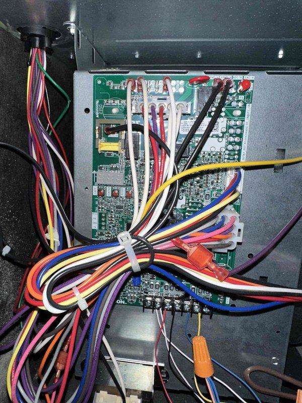 Completed fall heating maintenance tune-up on two Amana furnaces, both under 10 years old and covered under MVP Heating & Cooling plan. Performed comprehensive system inspection including control board diagnostics, electrical connection verification, and wiring harness examination. Inspected multiple green circuit boards within control panel enclosure, confirmed proper mounting and solder joint integrity of all electronic components including capacitors, resistors, and integrated circuits. Verified secure connections of multi-colored wiring bundles with proper zip tie management and wire nut terminations throughout the system. Replaced air filters on both units with new pleated filters, properly secured with horizontal strapping. All safety controls, electrical components, and mechanical systems tested and operating within manufacturer specifications. Both furnaces cleared for heating season operation with next maintenance scheduled for 2026.