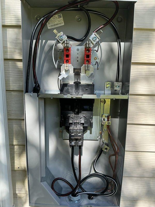 Completed a comprehensive 100-amp electrical service upgrade including full panel replacement and exterior service components. Removed existing outdated electrical infrastructure and installed new meter socket assembly with dual red meter adapters, proper grounding components, and updated service entrance conductors. Upgraded exterior conduit system using Schedule 40 PVC piping with appropriate fittings and couplings to house new service wiring. All work performed to current NEC standards with proper wire sizing, secure mounting hardware, and weatherproof connections for exterior installation.