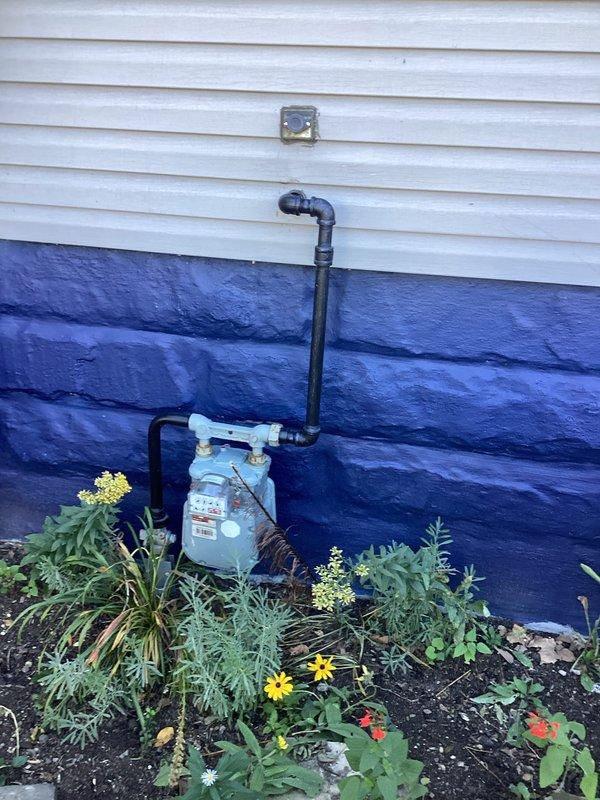 Installed exterior natural gas connection with shutoff valve and quick-connect fitting to supply a Predator 13,000-watt tri-fuel portable generator operating at 50A inlet capacity under full natural gas load. Ran new black iron gas piping from existing meter location to designated installation point on exterior wall, securing all lines with appropriate brackets and supports per code requirements. Installed ball-type shutoff valve and camlock-style quick-connect fitting rated for generator application, pressure-tested all connections to verify system integrity and proper gas flow for maximum generator demand. Installed exterior natural gas connection with shutoff valve and quick-connect fitting to supply a Predator 13,000-watt tri-fuel portable generator operating at 50A inlet capacity under full natural gas load. Ran new black iron gas piping from existing meter location to designated installation point on exterior wall, securing all lines with appropriate brackets and supports per code requirements. Installed ball-type shutoff valve and camlock-style quick-connect fitting rated for generator application, pressure-tested all connections to verify system integrity and proper gas flow for maximum generator demand.