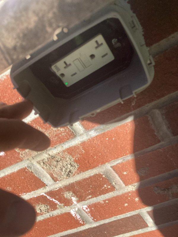 Responded to follow-up service call to inspect electrical system in outdoor kitchen area. Evaluated weatherproof GFCI outlet box mounted on exterior brick wall, confirming proper installation with hinged cover and protective housing suitable for outdoor exposure. Traced electrical circuit routing from outdoor receptacle location back to main utility room, documenting conduit pathways and connection points. Verified electrical conduit runs through utility space where multiple building systems converge, including plumbing and water filtration equipment. Photographed existing electrical infrastructure for service records and future reference. All outdoor electrical components appear code-compliant with appropriate weather-resistant enclosures for continued safe operation in exterior environment. Responded to follow-up service call to inspect electrical system in outdoor kitchen area. Evaluated weatherproof GFCI outlet box mounted on exterior brick wall, confirming proper installation with hinged cover and protective housing suitable for outdoor exposure. Traced electrical circuit routing from outdoor receptacle location back to main utility room, documenting conduit pathways and connection points. Verified electrical conduit runs through utility space where multiple building systems converge, including plumbing and water filtration equipment. Photographed existing electrical infrastructure for service records and future reference. All outdoor electrical components appear code-compliant with appropriate weather-resistant enclosures for continued safe operation in exterior environment.