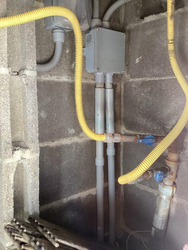 Responded to follow-up service call to inspect electrical system in outdoor kitchen area. Evaluated weatherproof GFCI outlet box mounted on exterior brick wall, confirming proper installation with hinged cover and protective housing suitable for outdoor exposure. Traced electrical circuit routing from outdoor receptacle location back to main utility room, documenting conduit pathways and connection points. Verified electrical conduit runs through utility space where multiple building systems converge, including plumbing and water filtration equipment. Photographed existing electrical infrastructure for service records and future reference. All outdoor electrical components appear code-compliant with appropriate weather-resistant enclosures for continued safe operation in exterior environment. Responded to follow-up service call to inspect electrical system in outdoor kitchen area. Evaluated weatherproof GFCI outlet box mounted on exterior brick wall, confirming proper installation with hinged cover and protective housing suitable for outdoor exposure. Traced electrical circuit routing from outdoor receptacle location back to main utility room, documenting conduit pathways and connection points. Verified electrical conduit runs through utility space where multiple building systems converge, including plumbing and water filtration equipment. Photographed existing electrical infrastructure for service records and future reference. All outdoor electrical components appear code-compliant with appropriate weather-resistant enclosures for continued safe operation in exterior environment.