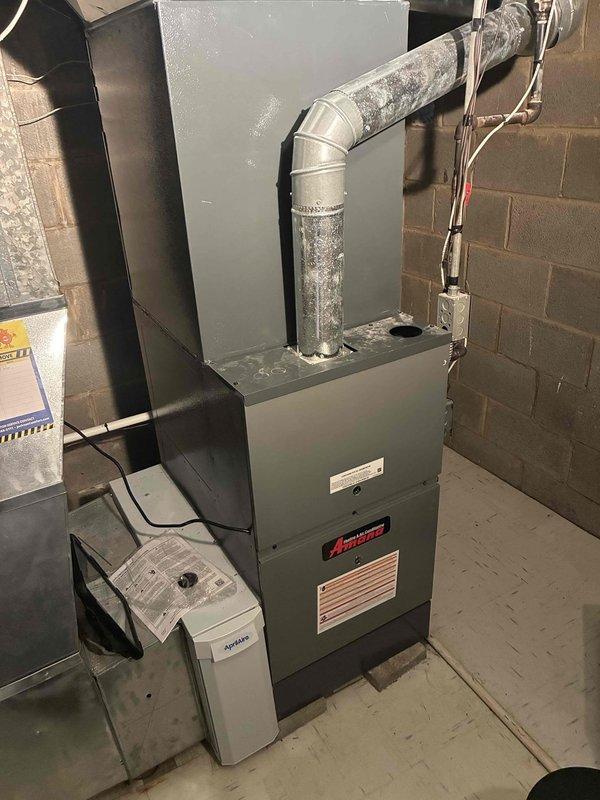 Completed preventive maintenance on two residential heating systems as part of recurring service agreement. Performed comprehensive inspection of Amana furnace unit including burner assembly, heat exchanger, blower motor, and electrical connections. Verified proper airflow through ductwork and checked for signs of wear or deterioration on metallic duct components. Conducted temperature diagnostics using calibrated digital thermometer, recording supply air temperature of 104.9°F to confirm proper heat output and system performance. Inspected auxiliary equipment including humidifier unit for proper operation. Examined condensate drainage system and noted moisture accumulation on metallic surfaces, confirming normal condensation patterns. Verified all safety controls, limit switches, and ignition components functioning within manufacturer specifications. Both heating systems tested and confirmed operational for the upcoming heating season. Completed preventive maintenance on two residential heating systems as part of recurring service agreement. Performed comprehensive inspection of Amana furnace unit including burner assembly, heat exchanger, blower motor, and electrical connections. Verified proper airflow through ductwork and checked for signs of wear or deterioration on metallic duct components. Conducted temperature diagnostics using calibrated digital thermometer, recording supply air temperature of 104.9°F to confirm proper heat output and system performance. Inspected auxiliary equipment including humidifier unit for proper operation. Examined condensate drainage system and noted moisture accumulation on metallic surfaces, confirming normal condensation patterns. Verified all safety controls, limit switches, and ignition components functioning within manufacturer specifications. Both heating systems tested and confirmed operational for the upcoming heating season.