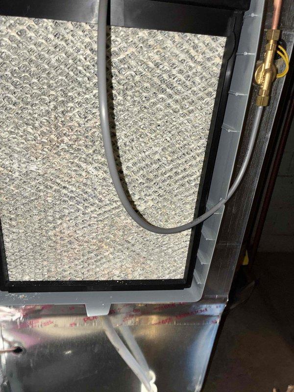 # HVAC Heating Maintenance Service
Completed comprehensive heating system maintenance on residential furnace unit. Performed thorough inspection of air handler assembly, including examination of air filter condition and housing integrity. Filter showed proper installation within black frame assembly with all mounting hardware secure. Verified condensate collection pan condition and drainage pathway, noting normal operational moisture levels.
Conducted detailed electrical diagnostics using digital multimeter to verify system voltage and control board functionality. Measured line voltage at 253.1 volts, confirming proper electrical supply to unit. Inspected control board for any signs of component failure or connection issues, with all wire terminals and connectors properly seated. Tested safety circuits and verified proper operation of all electrical connections including red, white, blue, and green control wiring.
Examined refrigerant line connections and brass fittings for any sign # HVAC Heating Maintenance Service
Completed comprehensive heating system maintenance on residential furnace unit. Performed thorough inspection of air handler assembly, including examination of air filter condition and housing integrity. Filter showed proper installation within black frame assembly with all mounting hardware secure. Verified condensate collection pan condition and drainage pathway, noting normal operational moisture levels.
Conducted detailed electrical diagnostics using digital multimeter to verify system voltage and control board functionality. Measured line voltage at 253.1 volts, confirming proper electrical supply to unit. Inspected control board for any signs of component failure or connection issues, with all wire terminals and connectors properly seated. Tested safety circuits and verified proper operation of all electrical connections including red, white, blue, and green control wiring.
Examined refrigerant line connections and brass fittings for any sign