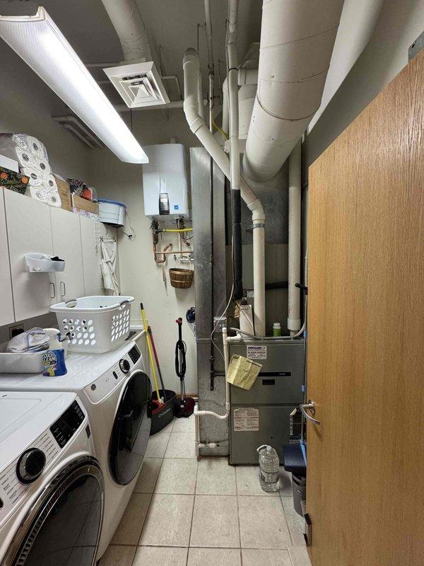 # HVAC Repair - Cooling System Efficiency Restoration

Responded to service call for significantly reduced cooling capacity on an 11-year-old air conditioning system. Upon arrival, performed comprehensive diagnostic evaluation of both indoor air handler unit located in utility room and outdoor condenser units positioned on rooftop. 

Conducted visual inspection of mechanical equipment, ductwork, and refrigerant line connections. Assessed airflow patterns through supply ductwork system and verified proper operation of air handler components. Examined outdoor condenser units for operational efficiency, checking louvered panels for adequate air circulation and inspecting copper refrigerant lines running along exterior wall for proper insulation and connections.

Identified efficiency issues affecting overall system performance. Performed necessary adjustments and repairs to restore cooling capacity to manufacturer specifications. Verified proper refrigerant pressures and system operation 