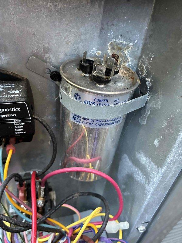 Completed comprehensive MVP maintenance on heating and cooling system for unit over 10 years old. Performed thorough inspection of outdoor condenser unit and internal electrical components, including dual-rated capacitor (40/5 MFD) with proper voltage specifications. All electrical connections, wiring harnesses, and terminals were examined and found secure with no signs of deterioration or loose connections. Verified capacitor functionality and tested compressor operation. Unit operating within normal parameters upon completion of maintenance service.