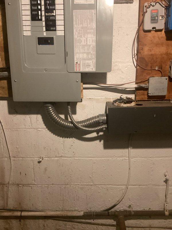 Conducted comprehensive on-site evaluation for 400 amp electrical panel upgrade. Assessed existing electrical distribution system including current panel configuration, circuit breaker arrangement, wire routing, and grounding infrastructure. Documented existing conditions showing dual-panel setup with circuit breakers, ground bar assembly, and associated conduit runs in utility space with concrete block wall construction. Photographed panel internals, wire connections, flexible metal conduit pathways, and auxiliary electrical components including junction boxes and control devices. Provided detailed technical assessment and prepared estimate for panel upgrade specifications. Conducted comprehensive on-site evaluation for 400 amp electrical panel upgrade. Assessed existing electrical distribution system including current panel configuration, circuit breaker arrangement, wire routing, and grounding infrastructure. Documented existing conditions showing dual-panel setup with circuit breakers, ground bar assembly, and associated conduit runs in utility space with concrete block wall construction. Photographed panel internals, wire connections, flexible metal conduit pathways, and auxiliary electrical components including junction boxes and control devices. Provided detailed technical assessment and prepared estimate for panel upgrade specifications.