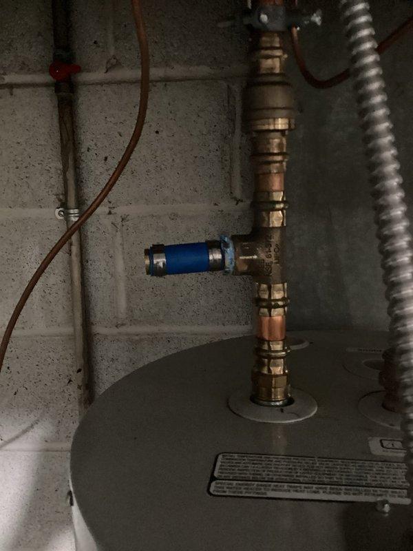 Responded to a water heater leak in the afternoon. Upon inspection, identified active leaking from corroded copper pipe fittings and connections in the water heater assembly. The copper piping showed significant oxidation and rust-colored mineral deposits at multiple connection points, indicating deterioration of the fittings. Documented the condition of the plumbing system, including the water pressure regulator, copper supply lines, and water heater connections for repair recommendations. Responded to a water heater leak in the afternoon. Upon inspection, identified active leaking from corroded copper pipe fittings and connections in the water heater assembly. The copper piping showed significant oxidation and rust-colored mineral deposits at multiple connection points, indicating deterioration of the fittings. Documented the condition of the plumbing system, including the water pressure regulator, copper supply lines, and water heater connections for repair recommendations.
