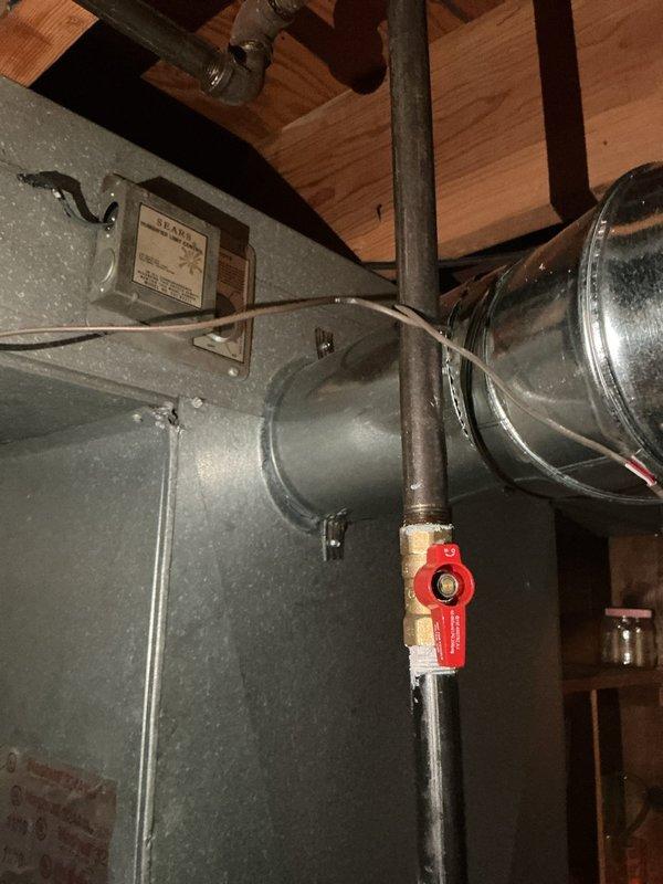 Successfully installed an AprilAire 600 whole-home humidifier integrated with the existing HVAC system. The unit was mounted to the floor joists in the utility area with proper structural support, connected to the main air handler ductwork via metallic ductwork, and plumbed with water supply lines including a shutoff valve with red handle for easy maintenance access. All electrical connections were completed with proper conduit and junction box installation, ensuring the humidification system is fully operational and ready to maintain optimal indoor humidity levels throughout the home. Successfully installed an AprilAire 600 whole-home humidifier integrated with the existing HVAC system. The unit was mounted to the floor joists in the utility area with proper structural support, connected to the main air handler ductwork via metallic ductwork, and plumbed with water supply lines including a shutoff valve with red handle for easy maintenance access. All electrical connections were completed with proper conduit and junction box installation, ensuring the humidification system is fully operational and ready to maintain optimal indoor humidity levels throughout the home.