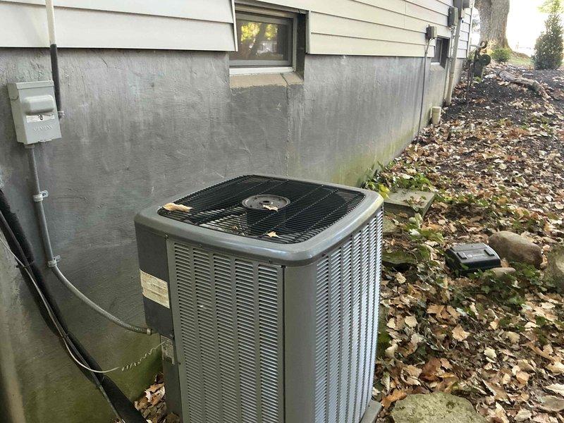 Completed full HVAC system replacement estimate at residential property with easy access conditions. Installation site evaluated for outdoor condenser unit and air handler placement on existing concrete pad at side of building, with electrical disconnect and conduit routing assessed. Property features suitable foundation clearance and adequate space for complete furnace and air conditioning system replacement with straightforward access for equipment installation.