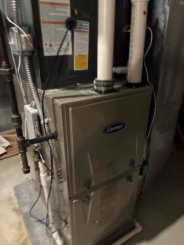 Completed scheduled heating maintenance on two-system HVAC installation. Performed comprehensive inspection of Carrier furnace unit, verified proper operation of all components, and documented electrical readings showing 120.9 volts at the system. All equipment found operating within normal parameters with no issues identified.