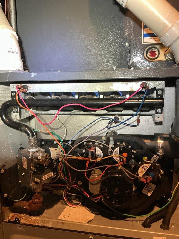 Responded to second service call to replace defective gas valve on heating unit. Removed access panel to electrical and mechanical compartment, disconnected multiple wire connections from failed gas valve assembly, and isolated gas supply. Installed new gas valve with proper electrical terminations including all control and safety circuit wiring. Verified all connections were secure, restored gas supply, and performed operational testing to confirm proper ignition sequence and flame sensing. Unit cycling normally with all safety controls functioning as designed.