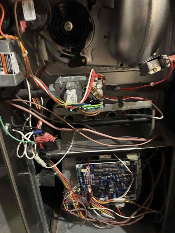 Performed comprehensive heating system maintenance on HVAC unit. Conducted operational testing using digital multimeter to verify proper voltage and amperage readings across system components. Inspected blower motor assembly, control board, and electrical connections. All wire terminations, wire nuts, and harness connections were examined and found secure. Control board circuitry and electronic components tested and functioning within normal parameters. System operational and ready for heating season.