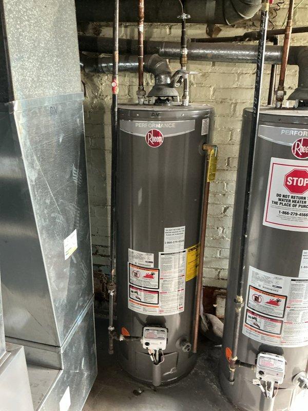 Performed flush and fill maintenance on two Rheem Performance tanked water heaters installed in basement mechanical room. Drained sediment buildup from both units through drain valves, flushed tanks with fresh water to remove mineral deposits and debris, then refilled systems and verified proper operation of all components including temperature/pressure relief valves and supply connections. All copper piping, shut-off valves, and connections inspected and confirmed secure with no leaks detected upon completion. Performed flush and fill maintenance on two Rheem Performance tanked water heaters installed in basement mechanical room. Drained sediment buildup from both units through drain valves, flushed tanks with fresh water to remove mineral deposits and debris, then refilled systems and verified proper operation of all components including temperature/pressure relief valves and supply connections. All copper piping, shut-off valves, and connections inspected and confirmed secure with no leaks detected upon completion.
