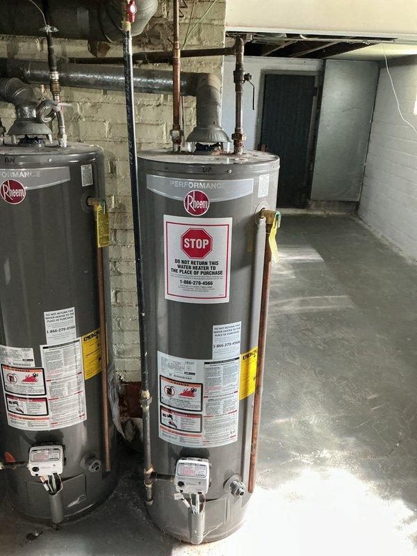 Performed flush and fill maintenance on two Rheem Performance tanked water heaters installed in basement mechanical room. Drained sediment buildup from both units through drain valves, flushed tanks with fresh water to remove mineral deposits and debris, then refilled systems and verified proper operation of all components including temperature/pressure relief valves and supply connections. All copper piping, shut-off valves, and connections inspected and confirmed secure with no leaks detected upon completion. Performed flush and fill maintenance on two Rheem Performance tanked water heaters installed in basement mechanical room. Drained sediment buildup from both units through drain valves, flushed tanks with fresh water to remove mineral deposits and debris, then refilled systems and verified proper operation of all components including temperature/pressure relief valves and supply connections. All copper piping, shut-off valves, and connections inspected and confirmed secure with no leaks detected upon completion.