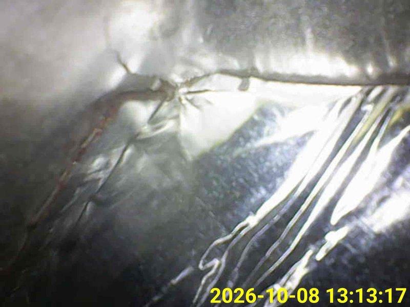 Completed comprehensive heating tune-up on residential furnace system located in utility closet. Performed standard maintenance inspection including examination of heat exchanger, burner assembly, blower components, and venting system with white PVC intake and exhaust pipes. Verified proper clearances, checked ductwork insulation integrity in attic space, and documented system condition with photos showing equipment operating within normal parameters.