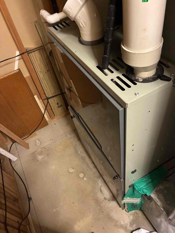 Completed comprehensive heating tune-up on residential furnace system located in utility closet. Performed standard maintenance inspection including examination of heat exchanger, burner assembly, blower components, and venting system with white PVC intake and exhaust pipes. Verified proper clearances, checked ductwork insulation integrity in attic space, and documented system condition with photos showing equipment operating within normal parameters.