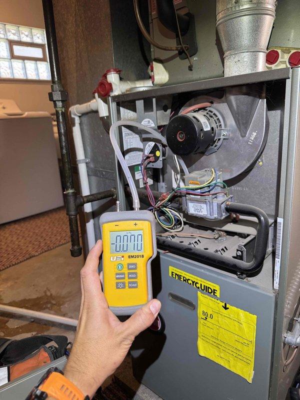 Responded to no-heat call on 11-year-old furnace system that shut down after recent gas service restoration. Upon arrival, performed comprehensive diagnostic testing using digital manometer, which revealed negative pressure reading of -70.70, indicating potential venting or combustion air issues. Removed front access panel and inspected internal components including blower motor, gas valve assembly, wiring harnesses, and heat exchanger. Verified gas supply was restored at exterior meter and regulator assembly on building exterior. Tested all electrical connections, safety switches, and control board functionality. Confirmed proper gas pressure at valve, checked ignition sequence, and verified flame sensor operation. System successfully restarted and cycled properly through complete heating operation. Educated customer on proper system operation following gas service interruptions and recommended monitoring system performance over next several cycles to ensure stable operation. Responded to no-heat call on 11-year-old furnace system that shut down after recent gas service restoration. Upon arrival, performed comprehensive diagnostic testing using digital manometer, which revealed negative pressure reading of -70.70, indicating potential venting or combustion air issues. Removed front access panel and inspected internal components including blower motor, gas valve assembly, wiring harnesses, and heat exchanger. Verified gas supply was restored at exterior meter and regulator assembly on building exterior. Tested all electrical connections, safety switches, and control board functionality. Confirmed proper gas pressure at valve, checked ignition sequence, and verified flame sensor operation. System successfully restarted and cycled properly through complete heating operation. Educated customer on proper system operation following gas service interruptions and recommended monitoring system performance over next several cycles to ensure stable operation.