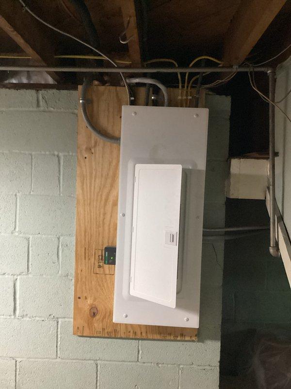 Completed a 100-amp electrical service upgrade with installation of a whole home surge protector. Removed the existing upstairs panel and installed a new main service panel on plywood backing in the basement utility area, utilizing 15 feet of #2 SER cable to establish proper connections. All work was performed to code with proper grounding and conduit installation to protect the new service entrance. Completed a 100-amp electrical service upgrade with installation of a whole home surge protector. Removed the existing upstairs panel and installed a new main service panel on plywood backing in the basement utility area, utilizing 15 feet of #2 SER cable to establish proper connections. All work was performed to code with proper grounding and conduit installation to protect the new service entrance.