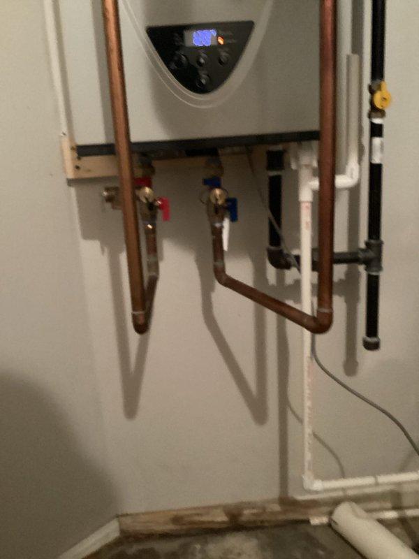 Performed routine maintenance flush on tankless water heater unit to remove mineral buildup and ensure optimal performance. Inspected isolation valves, copper supply lines, and verified proper operation of the heating system upon completion.