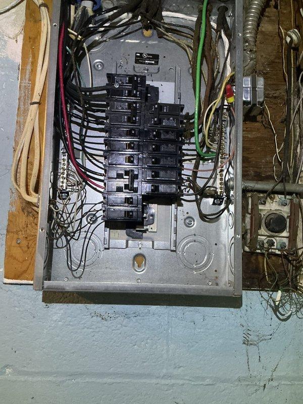 Responded to customer concern regarding intermittent insufficient grounding during EV charging for Tesla Model Y in garage. Conducted initial assessment of existing electrical infrastructure, including inspection of main electrical panel in basement and evaluation of current garage outlet configuration. Documented panel condition showing multiple circuit breakers and wire runs, noting aged installation with somewhat disorganized wiring bundles. Examined existing garage electrical outlet on cinder block wall and assessed grounding integrity. Provided customer with options for resolution including grounding repair versus installation of new dedicated 110V or 240V circuit from basement main panel to support reliable EV charging requirements. Initial site visit rescheduled to allow for material procurement and completion of recommended electrical work. Responded to customer concern regarding intermittent insufficient grounding during EV charging for Tesla Model Y in garage. Conducted initial assessment of existing electrical infrastructure, including inspection of main electrical panel in basement and evaluation of current garage outlet configuration. Documented panel condition showing multiple circuit breakers and wire runs, noting aged installation with somewhat disorganized wiring bundles. Examined existing garage electrical outlet on cinder block wall and assessed grounding integrity. Provided customer with options for resolution including grounding repair versus installation of new dedicated 110V or 240V circuit from basement main panel to support reliable EV charging requirements. Initial site visit rescheduled to allow for material procurement and completion of recommended electrical work.