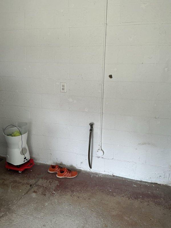 Responded to customer concern regarding intermittent insufficient grounding during EV charging for Tesla Model Y in garage. Conducted initial assessment of existing electrical infrastructure, including inspection of main electrical panel in basement and evaluation of current garage outlet configuration. Documented panel condition showing multiple circuit breakers and wire runs, noting aged installation with somewhat disorganized wiring bundles. Examined existing garage electrical outlet on cinder block wall and assessed grounding integrity. Provided customer with options for resolution including grounding repair versus installation of new dedicated 110V or 240V circuit from basement main panel to support reliable EV charging requirements. Initial site visit rescheduled to allow for material procurement and completion of recommended electrical work. Responded to customer concern regarding intermittent insufficient grounding during EV charging for Tesla Model Y in garage. Conducted initial assessment of existing electrical infrastructure, including inspection of main electrical panel in basement and evaluation of current garage outlet configuration. Documented panel condition showing multiple circuit breakers and wire runs, noting aged installation with somewhat disorganized wiring bundles. Examined existing garage electrical outlet on cinder block wall and assessed grounding integrity. Provided customer with options for resolution including grounding repair versus installation of new dedicated 110V or 240V circuit from basement main panel to support reliable EV charging requirements. Initial site visit rescheduled to allow for material procurement and completion of recommended electrical work.
