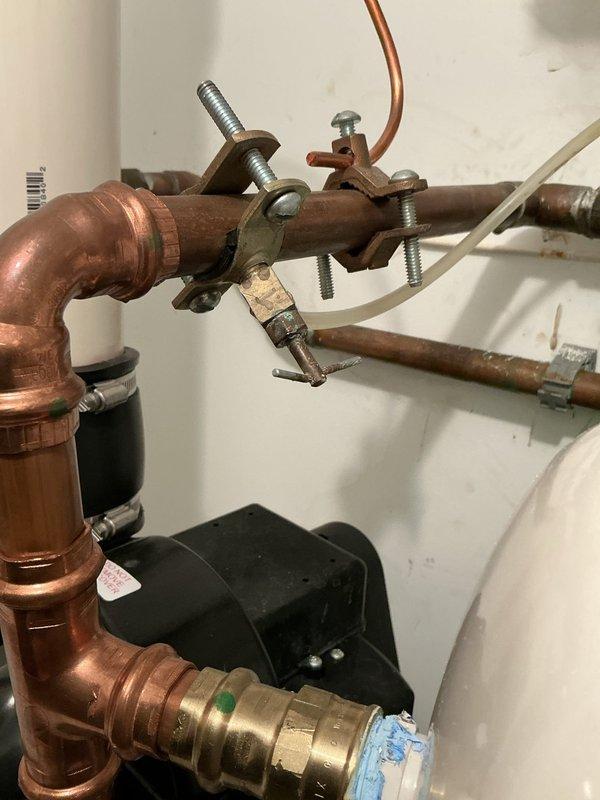 Completed HVAC estimate for furnace replacement in master bedroom utility closet. Assessed existing dark-colored furnace unit with associated water heater, copper plumbing assembly with motorized valve, and PVC ventilation system. Documented current equipment configuration including ductwork connections and provided replacement options for heating system upgrade. Completed HVAC estimate for furnace replacement in master bedroom utility closet. Assessed existing dark-colored furnace unit with associated water heater, copper plumbing assembly with motorized valve, and PVC ventilation system. Documented current equipment configuration including ductwork connections and provided replacement options for heating system upgrade.