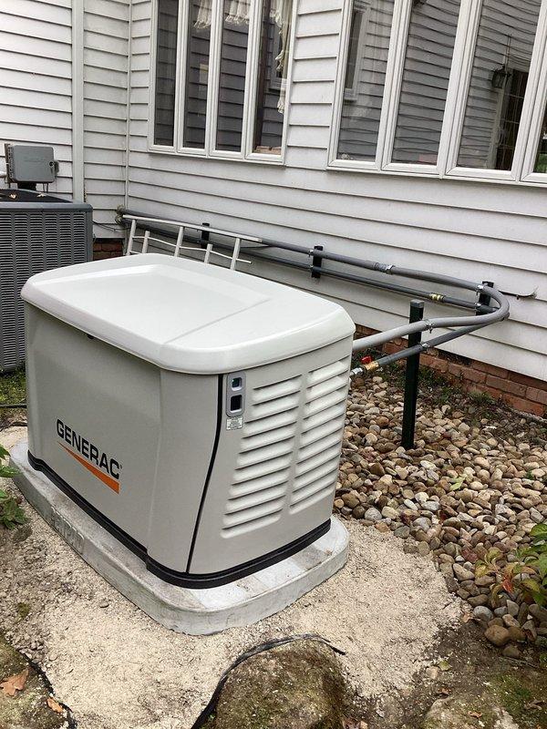 Completed full installation of 26kW Generac residential backup generator system. Installed generator unit on dedicated concrete pad with proper clearances from structure and HVAC equipment. Ran exterior conduit along building facade with secure mounting brackets to house electrical and gas connections. Installed and wired Generac transfer switch panel with control module, circuit breakers, and proper bus bar connections. Connected all required power conductors and established grounding per NEC requirements. Completed natural gas line installation from utility connection to generator fuel inlet. All electrical and gas line work performed in accordance with applicable building codes and manufacturer specifications. System includes standard 5-year engine warranty, 3-year parts warranty, and 2-year labor warranty. Verified proper installation alignment, tested all electrical connections, and confirmed system readiness for operation. Completed full installation of 26kW Generac residential backup generator system. Installed generator unit on dedicated concrete pad with proper clearances from structure and HVAC equipment. Ran exterior conduit along building facade with secure mounting brackets to house electrical and gas connections. Installed and wired Generac transfer switch panel with control module, circuit breakers, and proper bus bar connections. Connected all required power conductors and established grounding per NEC requirements. Completed natural gas line installation from utility connection to generator fuel inlet. All electrical and gas line work performed in accordance with applicable building codes and manufacturer specifications. System includes standard 5-year engine warranty, 3-year parts warranty, and 2-year labor warranty. Verified proper installation alignment, tested all electrical connections, and confirmed system readiness for operation.