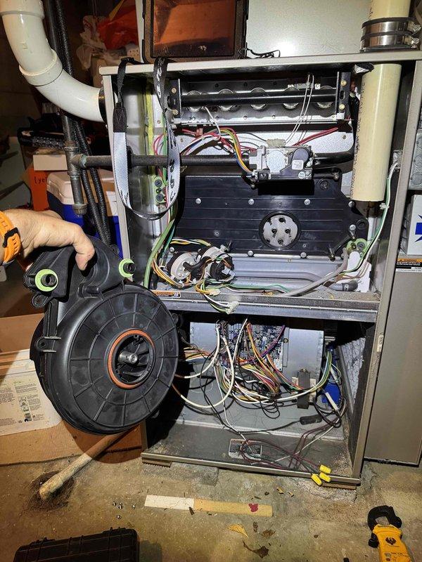 Responded to service call for furnace displaying induction fan motor warning. Performed diagnostic inspection of heating system and heat pump as requested. Removed and examined induction motor assembly, which showed signs of wear and operational issues. Disassembled furnace cabinet to access internal components including heat exchanger, blower assembly, and control wiring. Inspected blower motor, fan wheel, and associated electrical connections. Documented equipment condition with photos for service records. Removed faulty induction motor for replacement and verified all internal components were accessible for servicing. Responded to service call for furnace displaying induction fan motor warning. Performed diagnostic inspection of heating system and heat pump as requested. Removed and examined induction motor assembly, which showed signs of wear and operational issues. Disassembled furnace cabinet to access internal components including heat exchanger, blower assembly, and control wiring. Inspected blower motor, fan wheel, and associated electrical connections. Documented equipment condition with photos for service records. Removed faulty induction motor for replacement and verified all internal components were accessible for servicing.