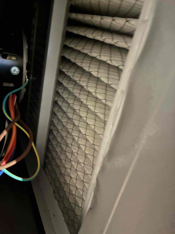 Completed scheduled heating system maintenance as part of ongoing service plan. Inspected furnace components and identified heavily soiled air filter with significant dust and debris accumulation throughout the pleated media, indicating extended use without replacement. Documented filter condition showing complete discoloration and clogging that would restrict airflow and reduce system efficiency. Verified electrical connections and capacitor during inspection, with all wiring observed to be properly secured within the air handler cabinet. Completed scheduled heating system maintenance as part of ongoing service plan. Inspected furnace components and identified heavily soiled air filter with significant dust and debris accumulation throughout the pleated media, indicating extended use without replacement. Documented filter condition showing complete discoloration and clogging that would restrict airflow and reduce system efficiency. Verified electrical connections and capacitor during inspection, with all wiring observed to be properly secured within the air handler cabinet.
