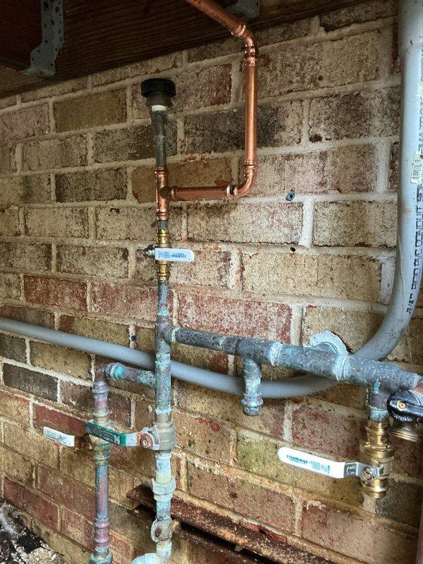 Installed new outdoor hose bib with proper freeze-proof configuration. Routed copper supply line from existing interior plumbing system through foundation wall to exterior mounting location. Completed installation includes shut-off valve for seasonal maintenance and secure mounting to prevent water damage.