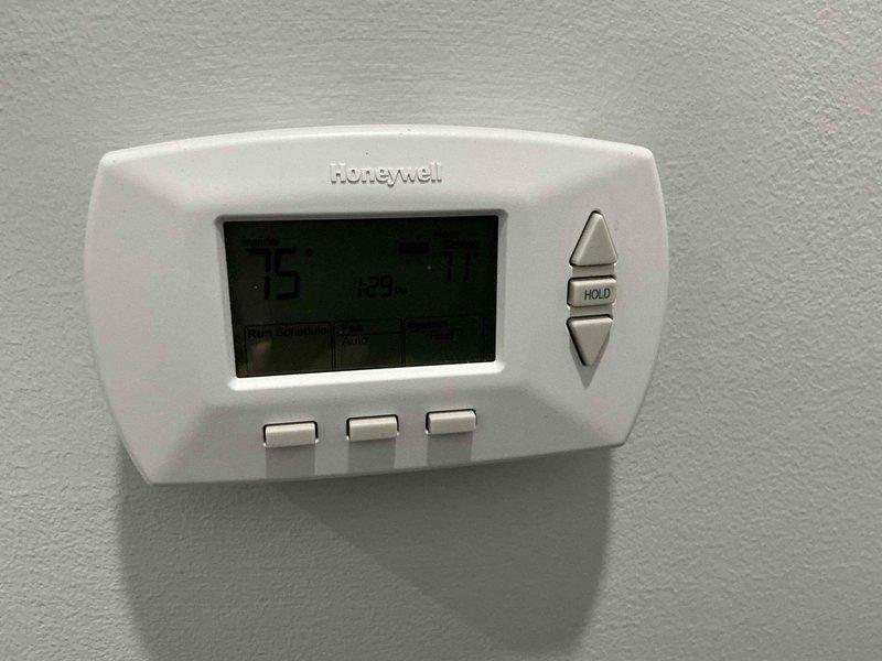 Conducted comprehensive furnace replacement assessment and presented complete system options to homeowner. Evaluated existing HVAC equipment including outdoor condensing unit and current Honeywell programmable thermostat to determine compatibility requirements and provide full replacement specifications for heating system upgrade.