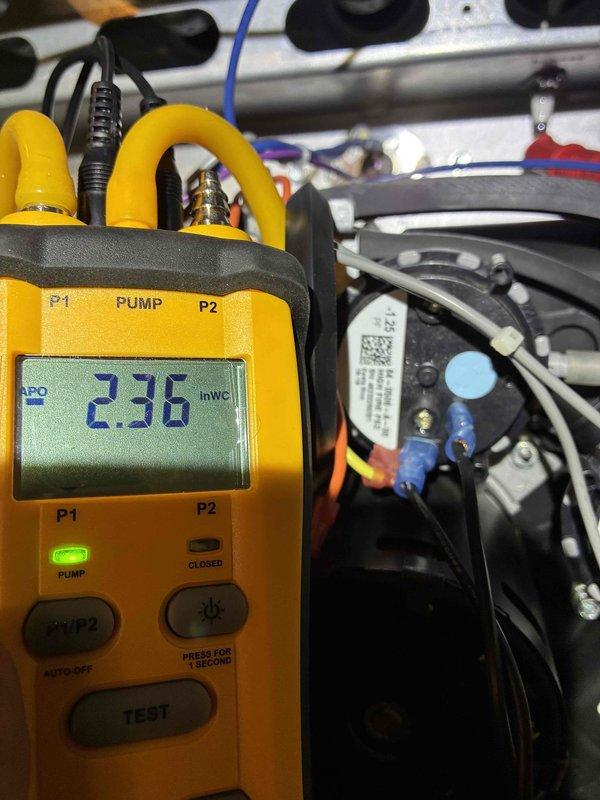 Completed scheduled heating maintenance on residential furnace system. Performed diagnostic testing using digital manometer, recording pressure readings of 236 inWc to verify proper system operation. Inspected blower wheel assembly, confirming clean condition with no debris accumulation or blade damage, and verified all electrical connections and motor components are functioning within normal parameters.