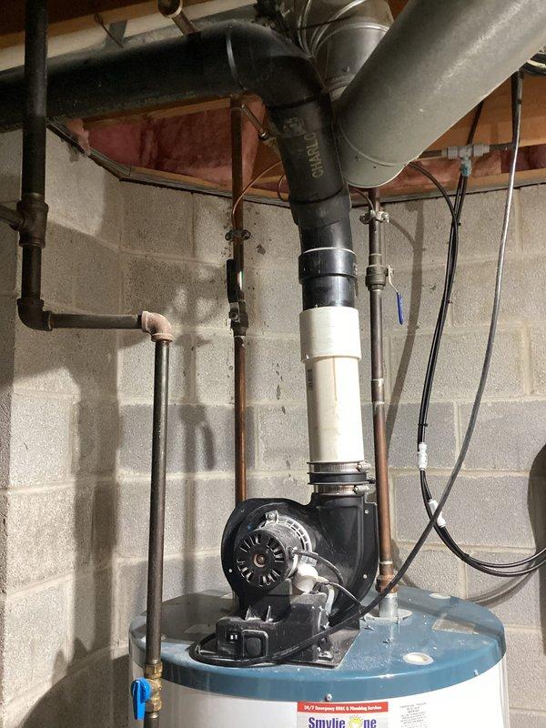 Responded to service call for tanked water heater with no hot water delivery to one side of the house. Upon arrival, inspected the White-Rodgers electronic control unit mounted on the water heater and observed status indicator lights showing green on cold side and yellow lights on heat side, indicating a control system malfunction. Diagnosed faulty temperature controller preventing proper heating element operation. Evaluated the complete plumbing configuration including copper supply lines, circulation pump assembly, and associated electrical connections. Verified proper gas supply and venting system integrity. Reset controller and tested heating elements to restore hot water distribution throughout the residence. Confirmed all safety systems operational and water temperature settings within manufacturer specifications.