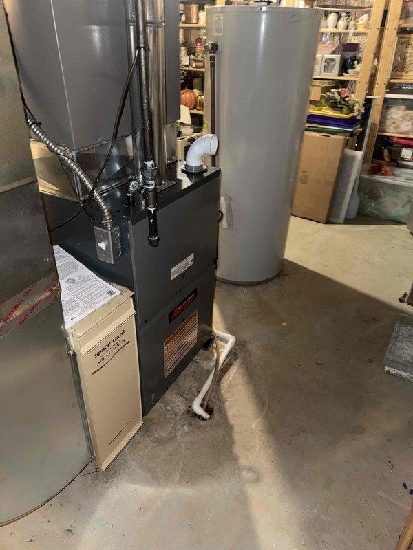 Installed a new 80% AFUE Amana gas furnace with a flue liner, connecting the gas supply line with a black iron pipe and flexible connector, and completing the electrical disconnect and condensate drain routing to the floor drain. Reconnected to the existing supply ductwork and Space-Gard air cleaner, then verified proper venting, safe combustion, and system operation at startup. Installed a new 80% AFUE Amana gas furnace with a flue liner, connecting the gas supply line with a black iron pipe and flexible connector, and completing the electrical disconnect and condensate drain routing to the floor drain. Reconnected to the existing supply ductwork and Space-Gard air cleaner, then verified proper venting, safe combustion, and system operation at startup.