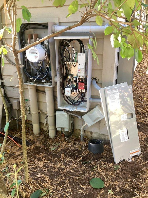 Installed a new transfer switch and three load sheds to integrate the standby generator with the home's electrical system, enabling automatic switching between utility and generator power. Terminated all conductors and routed conduit from the meter enclosure to the service panels, then verified connections for proper operation. Installed a new transfer switch and three load sheds to integrate the standby generator with the home's electrical system, enabling automatic switching between utility and generator power. Terminated all conductors and routed conduit from the meter enclosure to the service panels, then verified connections for proper operation.