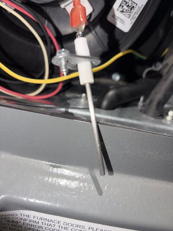 Performed scheduled heating maintenance on the furnace, inspecting the flame sensor rod, which was clean, straight, and securely mounted with no signs of corrosion or damage. Inspected the control board and low-voltage wiring in the cabinet, finding no rust, frost, or component damage, though the wire bundle is loosely routed and was noted for future tidying. The unit was left in good working condition. Performed scheduled heating maintenance on the furnace, inspecting the flame sensor rod, which was clean, straight, and securely mounted with no signs of corrosion or damage. Inspected the control board and low-voltage wiring in the cabinet, finding no rust, frost, or component damage, though the wire bundle is loosely routed and was noted for future tidying. The unit was left in good working condition.