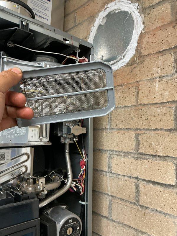 Performed scheduled heating maintenance on the hydronic boiler system, including inspection of the wall-mounted gas boiler's internal components (heat exchanger, gas valve assembly, blower housing, wiring harnesses, and Grundfos circulator) and the flue/vent termination. Removed and cleaned the boiler's mesh filter/screen, and inspected the inline circulator pump, copper piping, press fittings, isolation valves, and electrical conduit connections. No leaks, corrosion, or damage were observed, and the system was left in proper working order. Performed scheduled heating maintenance on the hydronic boiler system, including inspection of the wall-mounted gas boiler's internal components (heat exchanger, gas valve assembly, blower housing, wiring harnesses, and Grundfos circulator) and the flue/vent termination. Removed and cleaned the boiler's mesh filter/screen, and inspected the inline circulator pump, copper piping, press fittings, isolation valves, and electrical conduit connections. No leaks, corrosion, or damage were observed, and the system was left in proper working order.