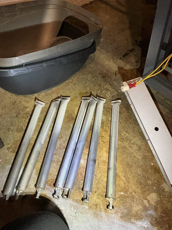 Performed annual tune-up on a Weil-McLain hydronic boiler (approx. 28 years old), including removal of the burner assembly for inspection and cleaning. Cleaned the burner tubes and pilot assembly of dust, rust, and scale buildup, then reinstalled and verified proper ignition and flame characteristics. Noted light scorching and age-related discoloration on components, with the unit operating normally at completion. Performed annual tune-up on a Weil-McLain hydronic boiler (approx. 28 years old), including removal of the burner assembly for inspection and cleaning. Cleaned the burner tubes and pilot assembly of dust, rust, and scale buildup, then reinstalled and verified proper ignition and flame characteristics. Noted light scorching and age-related discoloration on components, with the unit operating normally at completion.