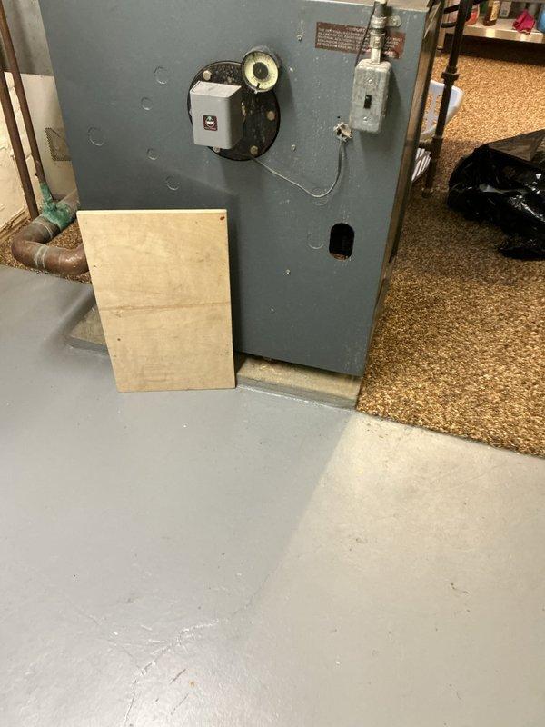 Performed an on-site evaluation of an approximately 40-year-old cast iron boiler in the basement utility area to determine replacement and upgrade options. Inspected the boiler controls, aquastat and pressure/temperature gauge, electrical disconnect, flue connection, and the aged copper and black iron distribution piping, noting heavy oxidation and tarnish throughout the system. Documented existing conditions, including clearances and venting, with photographs to support the replacement options presented to the customer. Performed an on-site evaluation of an approximately 40-year-old cast iron boiler in the basement utility area to determine replacement and upgrade options. Inspected the boiler controls, aquastat and pressure/temperature gauge, electrical disconnect, flue connection, and the aged copper and black iron distribution piping, noting heavy oxidation and tarnish throughout the system. Documented existing conditions, including clearances and venting, with photographs to support the replacement options presented to the customer.