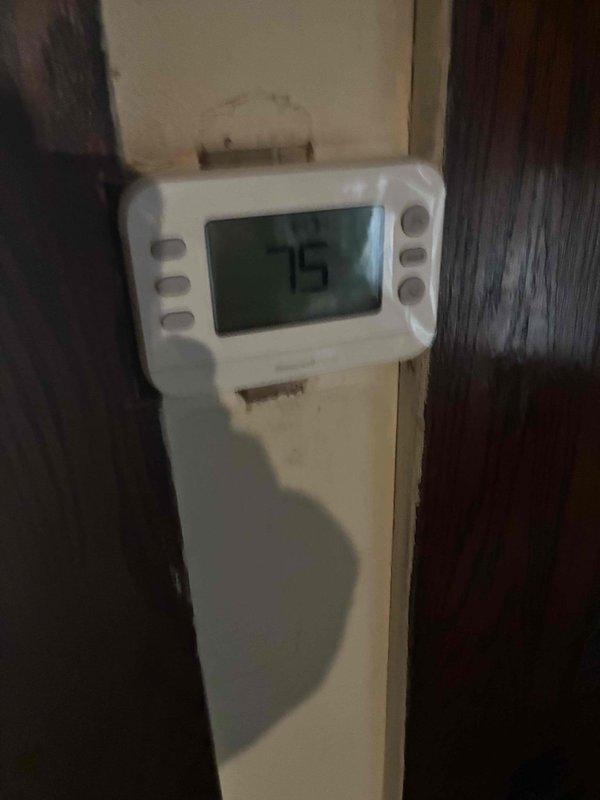 Responded to a no-heat call on a downflow furnace located in an unfinished basement and inspected the unit, its surrounding area, and the thermostat controls. Verified thermostat operation and call-for-heat functionality, then evaluated the furnace's ignition and safety circuits to diagnose the cause of the heating failure. Noted debris and lint accumulation near the unit and recommended clearing the area to maintain proper combustion air and clearances. Responded to a no-heat call on a downflow furnace located in an unfinished basement and inspected the unit, its surrounding area, and the thermostat controls. Verified thermostat operation and call-for-heat functionality, then evaluated the furnace's ignition and safety circuits to diagnose the cause of the heating failure. Noted debris and lint accumulation near the unit and recommended clearing the area to maintain proper combustion air and clearances.