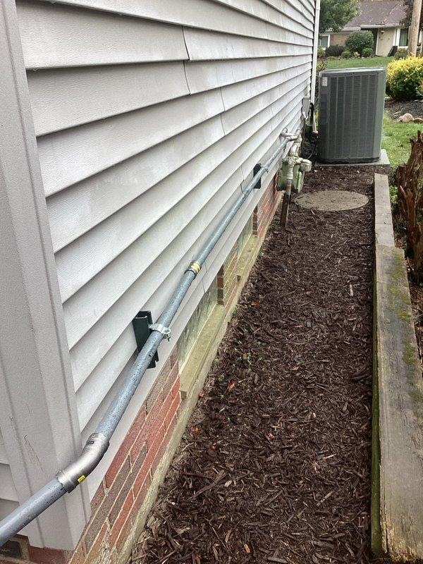 Installed a 24kW Generac standby generator with an automatic transfer switch on the exterior wall, running #2 THHN aluminum feeder conductors in conduit with Unistrut support. Terminated and torqued all connections to manufacturer specifications, connected the control module and low-voltage wiring, bonded the neutral and ground, and completed the gas line connection from the existing meter assembly. Installed a 24kW Generac standby generator with an automatic transfer switch on the exterior wall, running #2 THHN aluminum feeder conductors in conduit with Unistrut support. Terminated and torqued all connections to manufacturer specifications, connected the control module and low-voltage wiring, bonded the neutral and ground, and completed the gas line connection from the existing meter assembly.