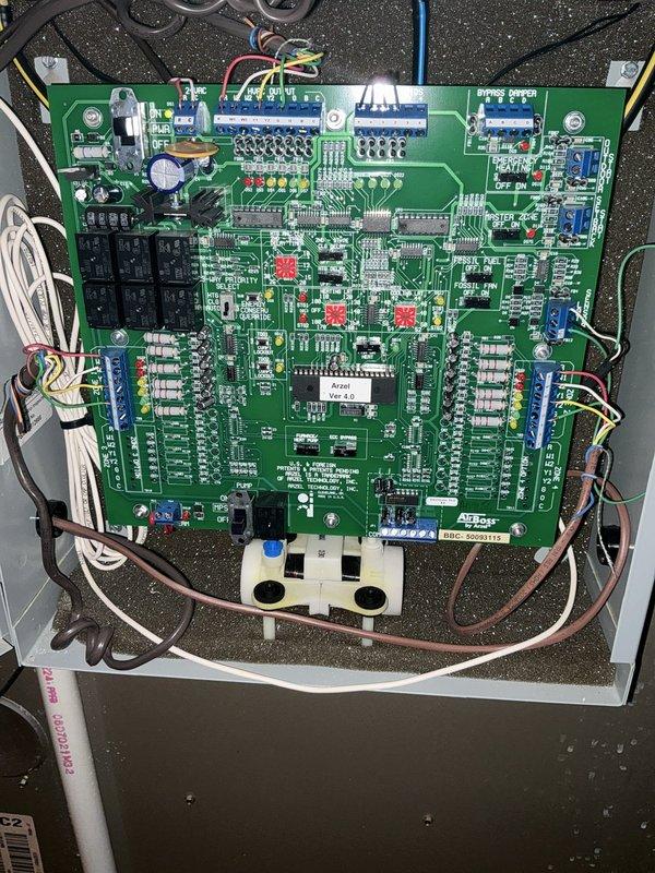 Performed an on-site evaluation of a three-zone residential HVAC system for a proposed replacement and expansion, including added heating and cooling for two attic spaces (one above the garage and one above the second floor). Inspected the existing zone control panel, which uses a bypass damper configuration, and documented the control board and wiring for compatibility with additional zones. Also documented the exterior electrical disconnect and meter enclosures, noting heavy corrosion, paint deterioration, and ivy overgrowth that should be addressed before any new equipment is connected. Performed an on-site evaluation of a three-zone residential HVAC system for a proposed replacement and expansion, including added heating and cooling for two attic spaces (one above the garage and one above the second floor). Inspected the existing zone control panel, which uses a bypass damper configuration, and documented the control board and wiring for compatibility with additional zones. Also documented the exterior electrical disconnect and meter enclosures, noting heavy corrosion, paint deterioration, and ivy overgrowth that should be addressed before any new equipment is connected.