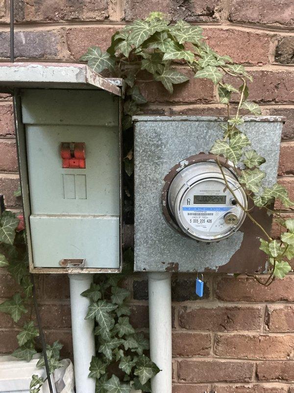 Performed an on-site evaluation of a three-zone residential HVAC system for a proposed replacement and expansion, including added heating and cooling for two attic spaces (one above the garage and one above the second floor). Inspected the existing zone control panel, which uses a bypass damper configuration, and documented the control board and wiring for compatibility with additional zones. Also documented the exterior electrical disconnect and meter enclosures, noting heavy corrosion, paint deterioration, and ivy overgrowth that should be addressed before any new equipment is connected. Performed an on-site evaluation of a three-zone residential HVAC system for a proposed replacement and expansion, including added heating and cooling for two attic spaces (one above the garage and one above the second floor). Inspected the existing zone control panel, which uses a bypass damper configuration, and documented the control board and wiring for compatibility with additional zones. Also documented the exterior electrical disconnect and meter enclosures, noting heavy corrosion, paint deterioration, and ivy overgrowth that should be addressed before any new equipment is connected.