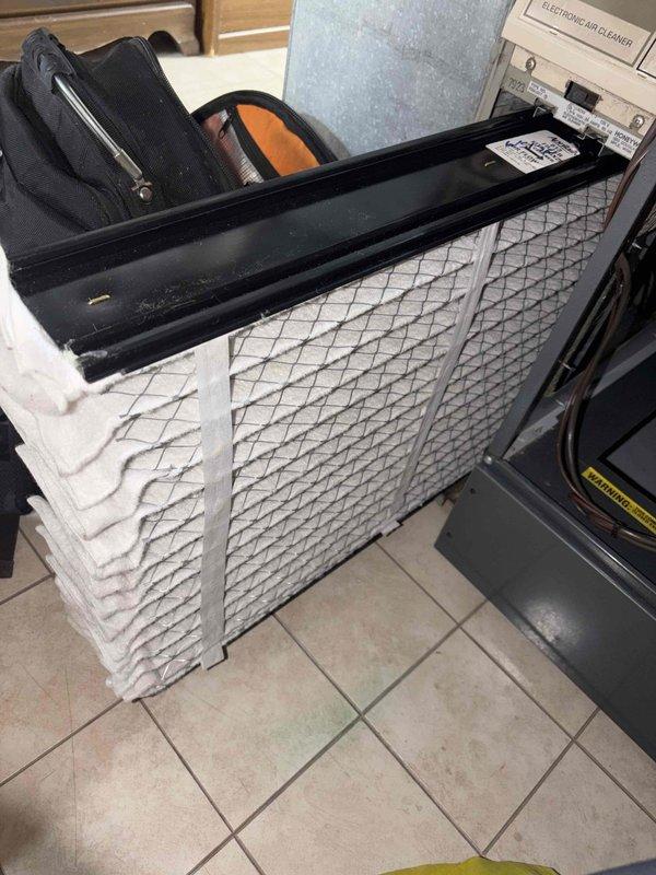 Performed scheduled heating maintenance on the furnace, inspecting the inducer motor assembly, pressure switch, and associated wiring connections. Noted surface corrosion on the inducer motor housing and a heavily soiled pleated filter at the electronic air cleaner section, with the filter removed for replacement. Recommend monitoring the inducer motor for continued corrosion and maintaining regular filter changes to ensure proper airflow and system efficiency. Performed scheduled heating maintenance on the furnace, inspecting the inducer motor assembly, pressure switch, and associated wiring connections. Noted surface corrosion on the inducer motor housing and a heavily soiled pleated filter at the electronic air cleaner section, with the filter removed for replacement. Recommend monitoring the inducer motor for continued corrosion and maintaining regular filter changes to ensure proper airflow and system efficiency.