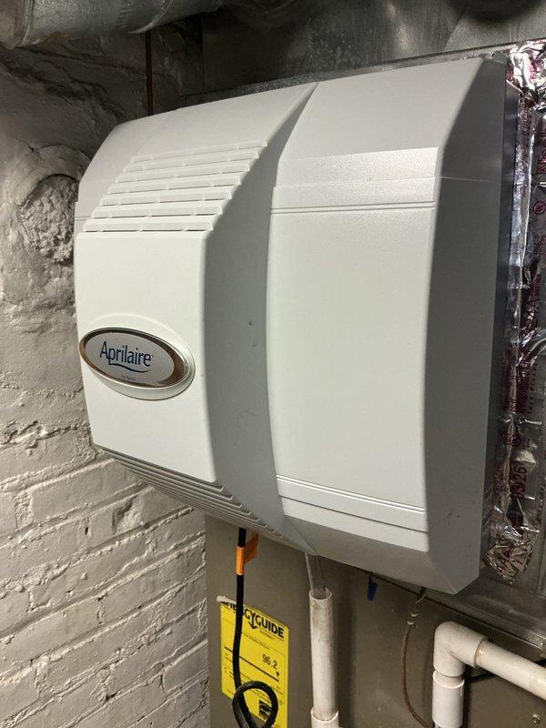 Responded to a non-functioning whole-house humidifier complaint and inspected the Aprilaire unit mounted on the supply plenum, including the water supply connection, drain line, and electrical wiring. Documented loose, exposed low-voltage wiring and connections at the unit for evaluation and correction, and verified the casing and mounting were clean and free of rust or damage. Responded to a non-functioning whole-house humidifier complaint and inspected the Aprilaire unit mounted on the supply plenum, including the water supply connection, drain line, and electrical wiring. Documented loose, exposed low-voltage wiring and connections at the unit for evaluation and correction, and verified the casing and mounting were clean and free of rust or damage.
